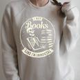 I Buy Books Like I’m Immortal Skeleton Bookworm Gothic Raglan Sleeve Sweatshirt Heather Forest I Buy Books Like I’m Immortal Skeleton Bookworm Gothic Raglan Sleeve Sweatshirt Heather Forest