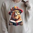 Capybara Bookworm Rodent Reading a Book Raglan Sleeve Sweatshirt Heather Forest