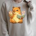 Capybara Reading a Book With Bubble Tea Raglan Sleeve Sweatshirt Heather Forest