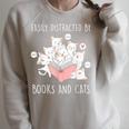 Cat & Book Lover Easily Distracted By Cats And Books For Men Women Kids Raglan Sleeve Sweatshirt Heather Forest