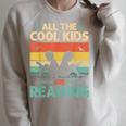 All The Cool Kids Are Reading Retro Book Lovers Reader Nerd Raglan Sleeve Sweatshirt Heather Forest