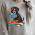 Dachshund Dog With Glasses Reading Book Librarian Raglan Sleeve Sweatshirt Heather Forest