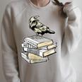 Dark Academia Aesthetic Raven Crow On Old Vintage Books Raglan Sleeve Sweatshirt Heather Forest