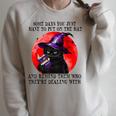 Some Days You Just Have To But On Cat Witch Reading Book Raglan Sleeve Sweatshirt Heather Forest