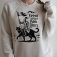 Defend Your Local Public Library Cat Knight Book Lover Raglan Sleeve Sweatshirt Heather Forest