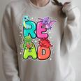 Dinosaur Read Book Lover Dino Reading Kids Premium Tri-Blend Raglan Sleeve Sweatshirt Heather Forest