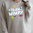 DOAWK Colorful Team Wimpy Sticker Collage Book Series Raglan Sleeve Sweatshirt Heather Forest DOAWK Colorful Team Wimpy Sticker Collage Book Series Raglan Sleeve Sweatshirt Heather Forest