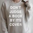 Don't Judge A Book By Its Cover Raglan Sleeve Sweatshirt Heather Forest Don't Judge A Book By Its Cover Raglan Sleeve Sweatshirt Heather Forest