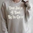 Don’t Judge a Book By Its Cover Tattoo Raglan Sleeve Sweatshirt Heather Forest