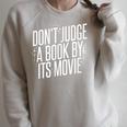 Don't Judge A Book By Its Movie Raglan Sleeve Sweatshirt Heather Forest Don't Judge A Book By Its Movie Raglan Sleeve Sweatshirt Heather Forest