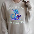 Dragon Reading Book Lover Leave Me Alone I'm Reading Raglan Sleeve Sweatshirt Heather Forest Dragon Reading Book Lover Leave Me Alone I'm Reading Raglan Sleeve Sweatshirt Heather Forest
