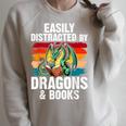 Dragon Reading Book Retro Vintage 80s Library Bookworm Raglan Sleeve Sweatshirt Heather Forest