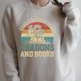 Easily Distracted By Books & Dragons Bookworm Reading Raglan Sleeve Sweatshirt Heather Forest Easily Distracted By Books & Dragons Bookworm Reading Raglan Sleeve Sweatshirt Heather Forest