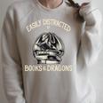 Easily Distracted By Books And Dragons Book Dragon Lover Raglan Sleeve Sweatshirt Heather Forest
