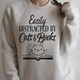 Easily Distracted By Cats & Books Cute Cat Book Lover Raglan Sleeve Sweatshirt Heather Forest