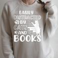Easily Distracted By Cats And Books Cats & Book Lovers Raglan Sleeve Sweatshirt Heather Forest