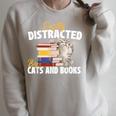 Easily Distracted By Cats And Books Bookworm Pet Lover Raglan Sleeve Sweatshirt Heather Forest Easily Distracted By Cats And Books Bookworm Pet Lover Raglan Sleeve Sweatshirt Heather Forest