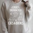 Easily Distracted By Cats And Books Cat Book Lover Short Premium Tri-Blend Raglan Sleeve Sweatshirt Heather Forest
