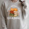 Easily Distracted By Cats And Books Cat And Book Lover Raglan Sleeve Sweatshirt Heather Forest Easily Distracted By Cats And Books Cat And Book Lover Raglan Sleeve Sweatshirt Heather Forest