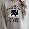 Easily Distracted By Cats And Books Cat Book Lover Raglan Sleeve Sweatshirt Heather Forest