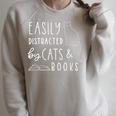 Easily Distracted Cats And Books For Cat Lovers For Men Women Kids Raglan Sleeve Sweatshirt Heather Forest