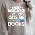 Easily Distracted By Cats And Books Cute Cat And Book Lovers Raglan Sleeve Sweatshirt Heather Forest
