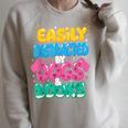 Easily Distracted By Dogs & Books Kawaii Dog & Book Lover Raglan Sleeve Sweatshirt Heather Forest
