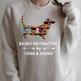 Easily Distracted By Dogs & Books Raglan Sleeve Sweatshirt Heather Forest
