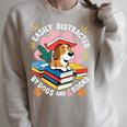 Easily Distracted By Dogs And Books Pets Books Lovers Raglan Sleeve Sweatshirt Heather Forest