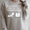 Easily Distracted By Dragon And Books Nerds Raglan Sleeve Sweatshirt Heather Forest Easily Distracted By Dragon And Books Nerds Raglan Sleeve Sweatshirt Heather Forest