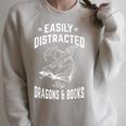Easily Distracted By Dragons & Books Book Lover Raglan Sleeve Sweatshirt Heather Forest