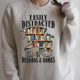 EASILY DISTRACTED BY DRAGONS & BOOKS Medieval Fantasy Reader Raglan Sleeve Sweatshirt Heather Forest