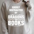 Easily Distracted By Dragons And Books Premium Tri-Blend Raglan Sleeve Sweatshirt Heather Forest