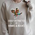 Easily Distracted By Hawks & Books Lover Falcon Bird Raglan Sleeve Sweatshirt Heather Forest
