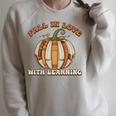 Fall In Love With Learning Books Pumpkin Autum Thanksgiving Raglan Sleeve Sweatshirt Heather Forest