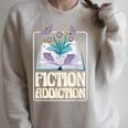 Fiction Addiction Book Reader And Booklover Raglan Sleeve Sweatshirt Heather Forest