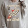 A Good Book Out Of This World Astronaut Space Reading Lovers Raglan Sleeve Sweatshirt Heather Forest