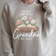 Grandma Est 2027 Best Chapter Yet Floral Book Premium Tri-Blend Raglan Sleeve Sweatshirt Heather Forest