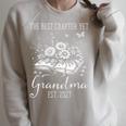 Grandma Est 2027 Best Chapter Yet Floral Book Raglan Sleeve Sweatshirt Heather Forest