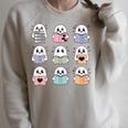 Halloween Ghosts Reading Books Pattern Spooky Kawaii Anime Raglan Sleeve Sweatshirt Heather Forest