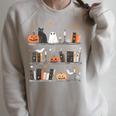 Halloween Library Ghost Books Teacher Spooky Trick Or Teach Raglan Sleeve Sweatshirt Heather Forest