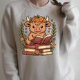 Highland Cow Reading Book Graphic Cow With Book Floral Raglan Sleeve Sweatshirt Heather Forest Highland Cow Reading Book Graphic Cow With Book Floral Raglan Sleeve Sweatshirt Heather Forest