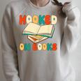 Hooked On Books Retro Reader Raglan Sleeve Sweatshirt Heather Forest Hooked On Books Retro Reader Raglan Sleeve Sweatshirt Heather Forest