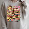 I'm The Librarian Of Summer Groovy Rainbow Retro Book Lover Raglan Sleeve Sweatshirt Heather Forest