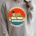 Kids Preschool Graduate Sloth Graduation Cap Sleeping On Books Raglan Sleeve Sweatshirt Heather Forest Kids Preschool Graduate Sloth Graduation Cap Sleeping On Books Raglan Sleeve Sweatshirt Heather Forest