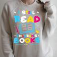 Kindergarten Teacher I Still Read Childrens Books Raglan Sleeve Sweatshirt Heather Forest