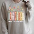 Labor And Delivery Nurse Book Wildflower Mother Baby Nursing Raglan Sleeve Sweatshirt Heather Forest Labor And Delivery Nurse Book Wildflower Mother Baby Nursing Raglan Sleeve Sweatshirt Heather Forest