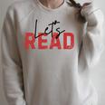 Let's Read National Read A Book Day Reading Month Freedom Raglan Sleeve Sweatshirt Heather Forest Let's Read National Read A Book Day Reading Month Freedom Raglan Sleeve Sweatshirt Heather Forest