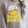 Let's Taco About Books Mexican Pun Bookworm Premium Tri-Blend Raglan Sleeve Sweatshirt Heather Forest