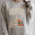 Library Dream Team Mountain Of Books Librarian Premium Tri-Blend Raglan Sleeve Sweatshirt Heather Forest